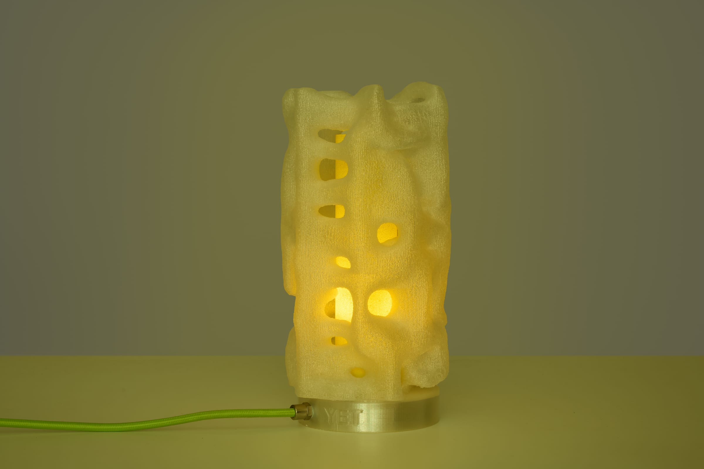 ALHERD Table Lamp — green cable, yellow filter, lit